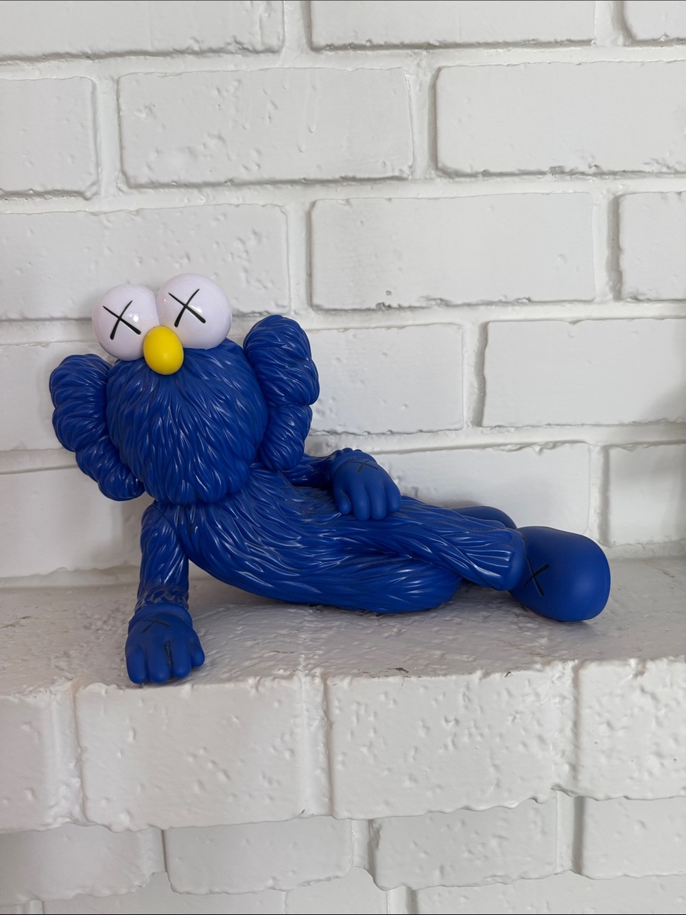 KAWS Royal Blue Companion Lounging Figure with Yellow Nose